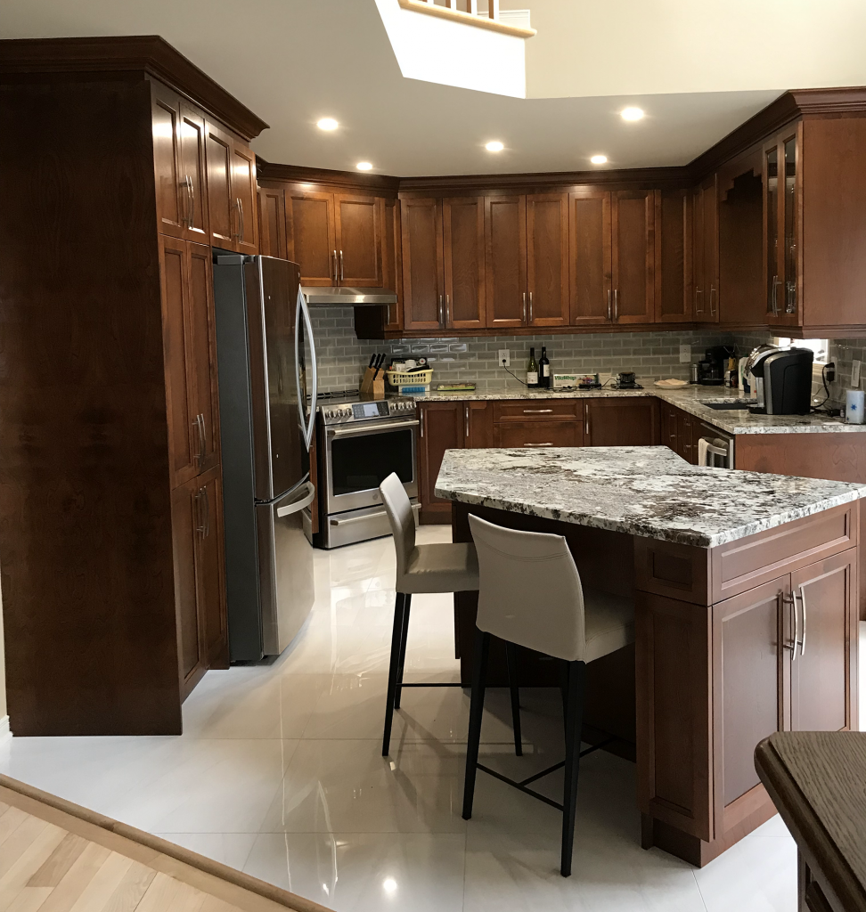 Kitchen: Wood cabinets and stone counters