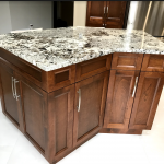 Kitchen: Wood cabinets and stone counters